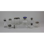 A collection of of nine various silver mounted glass dressing table jar and scent bottles (a/f)