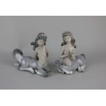 A pair of Lladro porcelain child centaur figures with flowers in their hair 14cm high