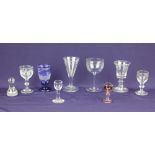 A collection of 19th century and later drinking glasses, most engraved, to include a blue Bohemian