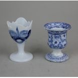 A Meissen blue and white porcelain egg cup decorated with an orchid 8cm high, together with a 19th