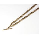 A 9ct gold curb link watch chain with fob and two spring hook clasps, 22g