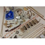A quantity of silver and costume jewellery together with four military badges