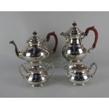 A George V silver four piece tea and coffee set baluster shape with dome lids, to include teapot,