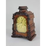 A walnut mantle clock by Blundell London in fluted scroll carved case the gilt engraved dial with