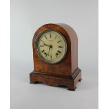 A 19th century walnut domed mantle clock with circular enamel dial signed Camerer, Kuss & Co.,