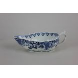 A Worcester porcelain 'Doughnut Tree' pattern blue and white sauce boat, of fluted form, the