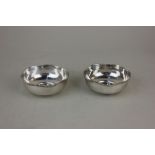 A pair of Continental white metal circular bowls with beaded wavy rims, base stamped silver, 2.7cm