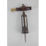 A George Twiggs patent steel corkscrew with wooden handle and brush, pillars stamped G Twiggs