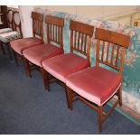 A set of four Sheraton style mahogany dining chairs with curved top rail above a five bar back,