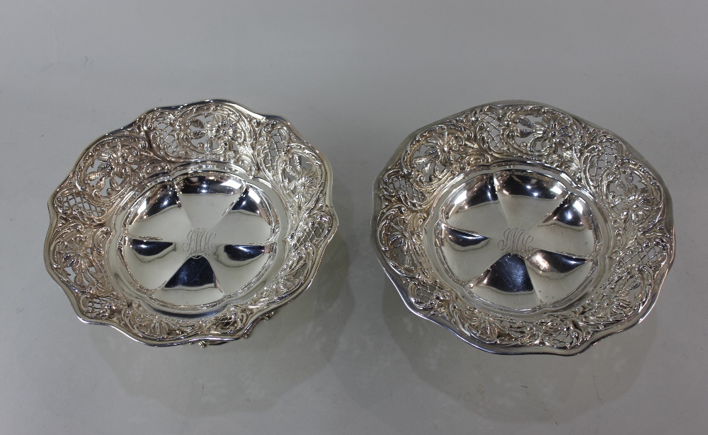 A pair of sterling silver pedestal dishes with lobed centres and floral and scroll embossed - Image 2 of 2