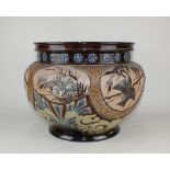 A Doulton Lambeth glazed stoneware large jardiniere / pot, decorated with panels of birds and