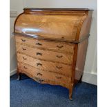 A Louis XVI style inlaid cylinder bureau with floral inlaid fall enclosing small drawers and