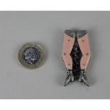 A small German novelty ladies legs pocket corkscrew with pink stockings, worm head stamped