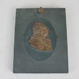 A 19th century bronzed metal portrait profile of a gentleman mounted on rectangular plaque plaque