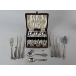 A cased set of six George VI silver coffee spoons with bean terminals, a Victorian silver cake