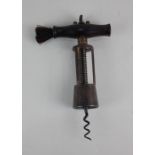 A Perry & Co. patent three-pillar steel corkscrew with wooden handle and brush, pillars stamped