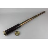 A brass and half leather clad three drawer telescope by Stanley London 65cm