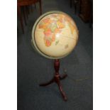 A modern light-up globe 'The Classica from Cram Herff-Jones Education Division', on mahogany