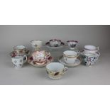 A collection of late 18th / 19th century porcelain tea cups and saucers, tea bowls and coffee