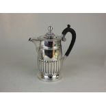 A Victorian silver hot water jug demi-reeded cylindrical form, maker Henry Stratford, London 1893,
