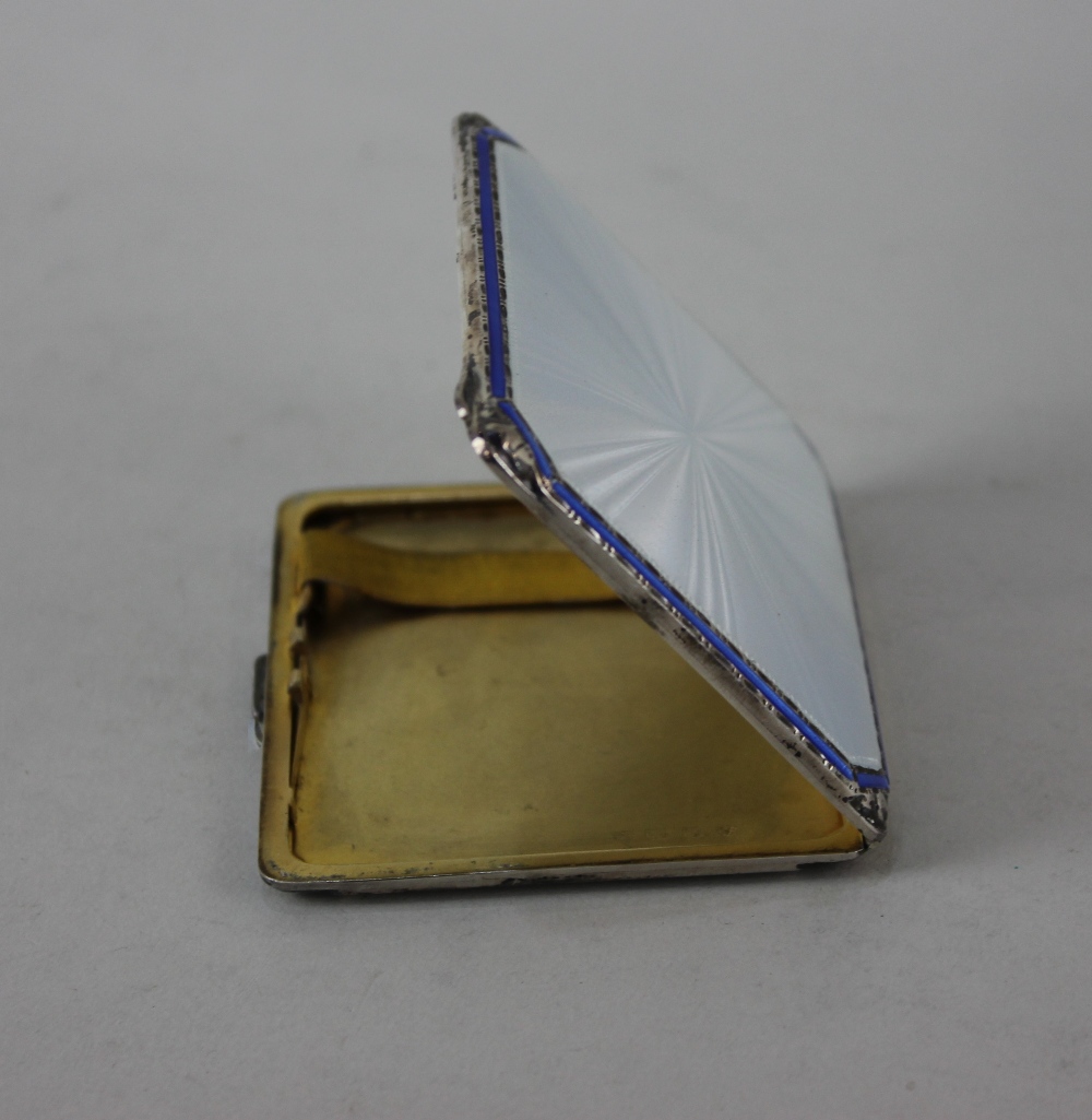 A George VI silver cigarette case with silver guilloche and blue enamelled lid and gilt interior - Image 2 of 2