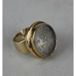 An intaglio rock crystal ring, set in 9ct gold marked '375', bearing the royal coat of arms of