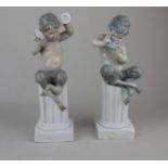 A pair of Lladro porcelain satyr / faun figures playing musical instruments and seated atop