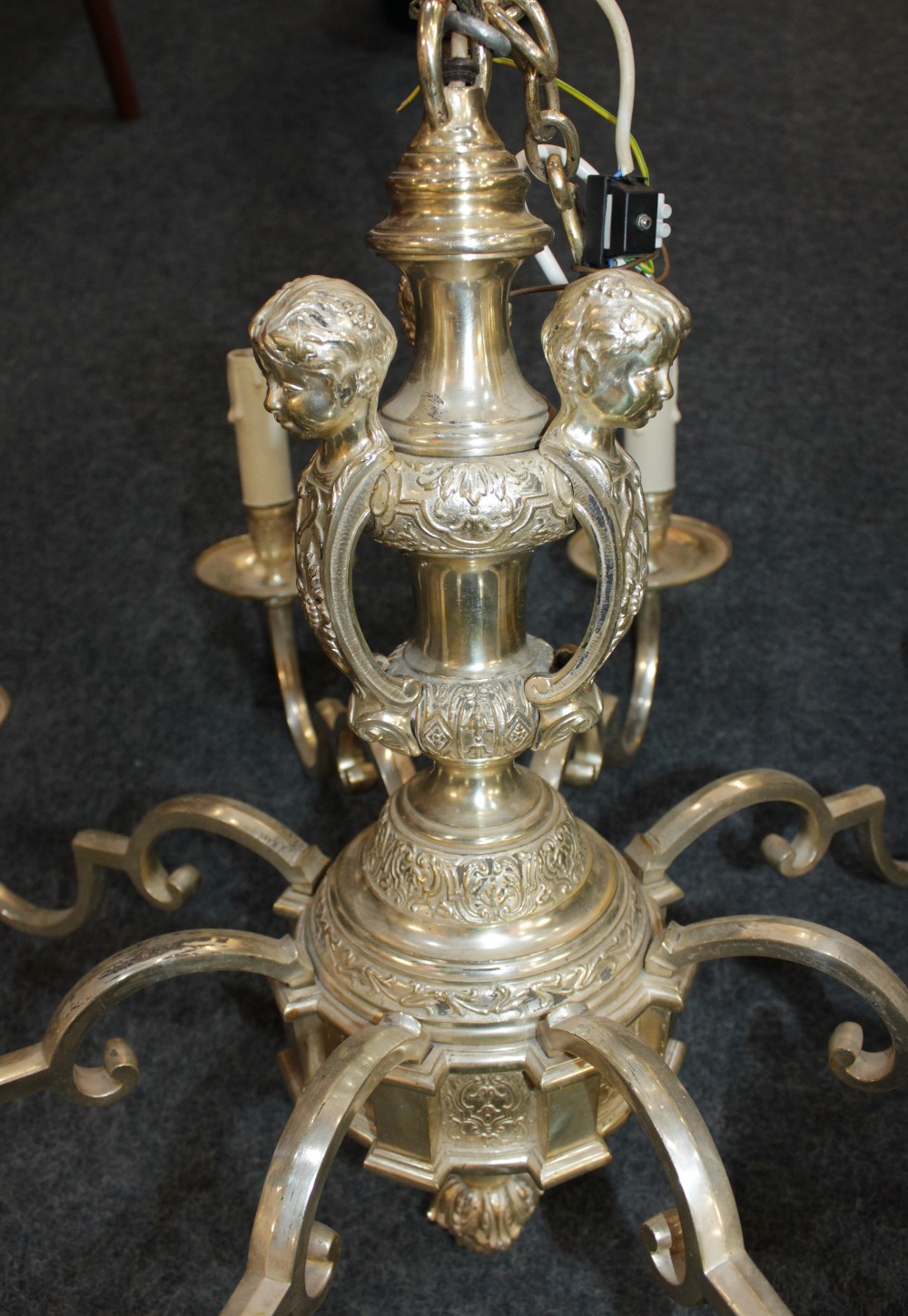 A silver plated 'Knole' eight light chandelier the stem decorated with cherub mounts, with scroll - Image 2 of 3