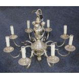 A silver plated 'Knole' eight light chandelier the stem decorated with cherub mounts, with scroll