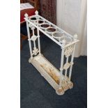 A white painted cast iron stick or umbrella stand the rectangular frame with six division top and