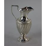 An Edward VII silver cream jug neo-classical form with spiral fluting on circular base, maker George