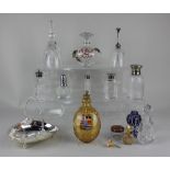 A small collection of glass scent bottles, some metal mounted, together with an amber glass flask