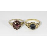 A 9ct gold garnet flower head ring and an agate cabochon ring