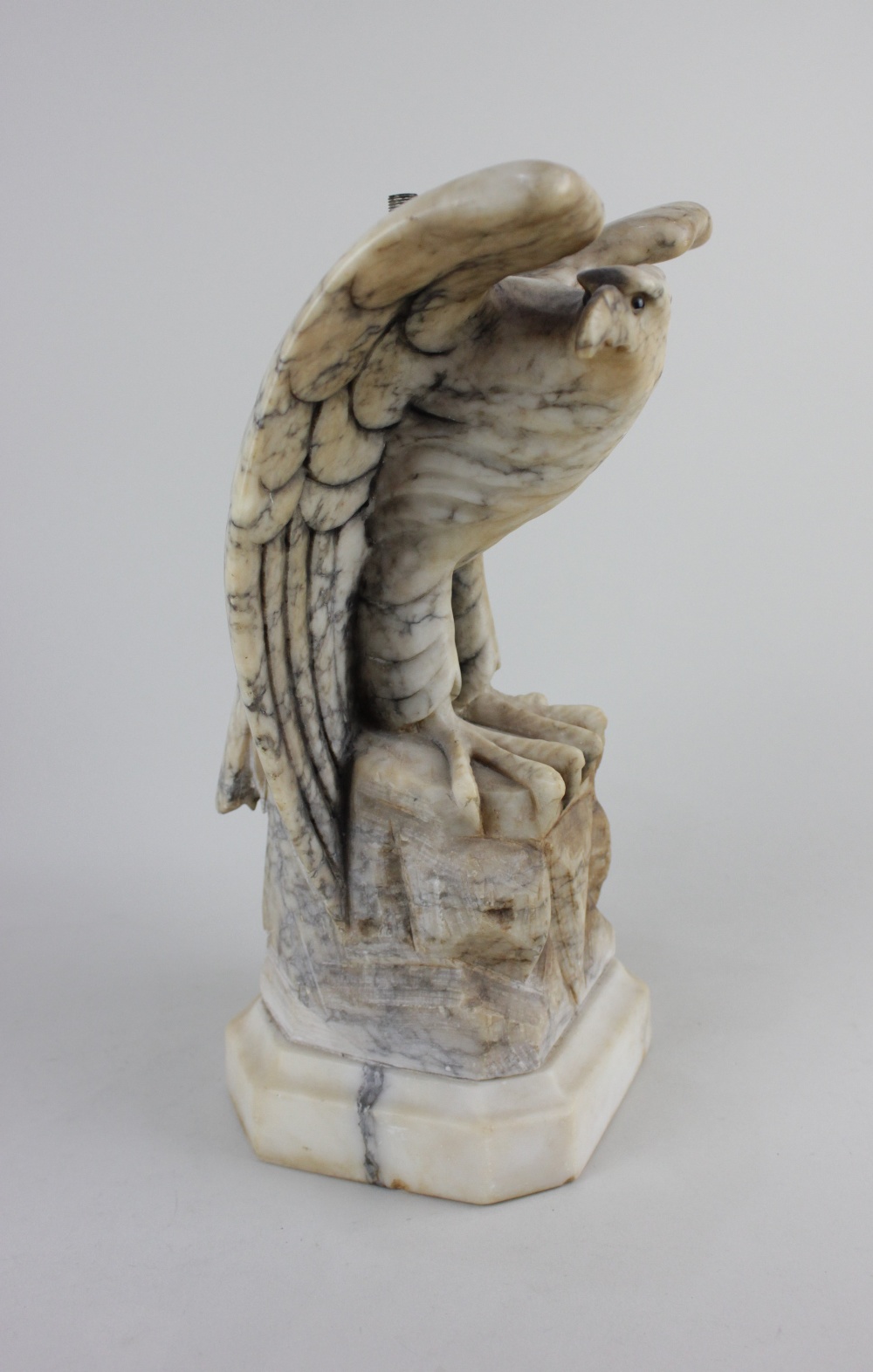 A marble model of an eagle converted to a table lamp 30cm high (a/f - fittings missing)