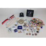 A quantity of costume jewellery to include necklaces, brooches etc