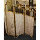 A Louis XV style giltwood and gesso framed three division room screen each graduated section with