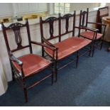 An Edwardian mahogany three piece salon suite comprising two seater settee and a pair of open