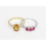 A ruby three stone ring, with another gem-set ring, both in 10k gold