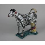 A Staffordshire pottery cow creamer and milkmaid group with sponged decoration 14.5cm high (a/f -
