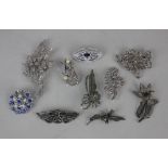 A collection of ten costume jewellery brooches some set with marcasite