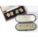 A pair of 9ct gold cufflinks 9.9g and a set of three yellow metal collar studs, both in fitted