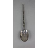 An Edward VII silver annoiting spoon with engraved bowl and cast handles maker James Wakely &