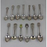 A collection of early 20th century silver teaspoons including five commemorative and two Victorian