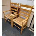 A pair of modern beech ladderback chairs with rush seats