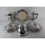 Two silver plated oval tureens and covers with beaded borders, a dome cover, circular cake stand