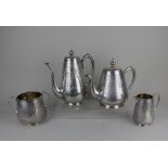 A Victorian silver matched four-piece tea and coffee set to include a teapot, coffee pot, cream