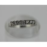 A diamond seven stone ring in 18ct white gold