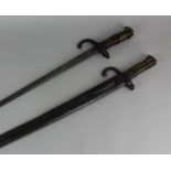 An American bayonet the back of the blade marked 'Christopher Columbus', in steel scabbard, together