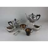 A Mappin & Webb three-piece silver plated Art Deco tea set circular shape (a/f) another three