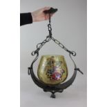 A ceiling light fitting with amber glass shade decorated with knights in armour approx 57cm long,